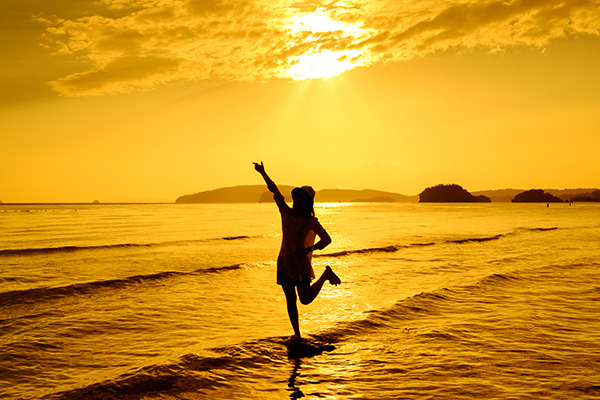 Woman on beach - vitamin D